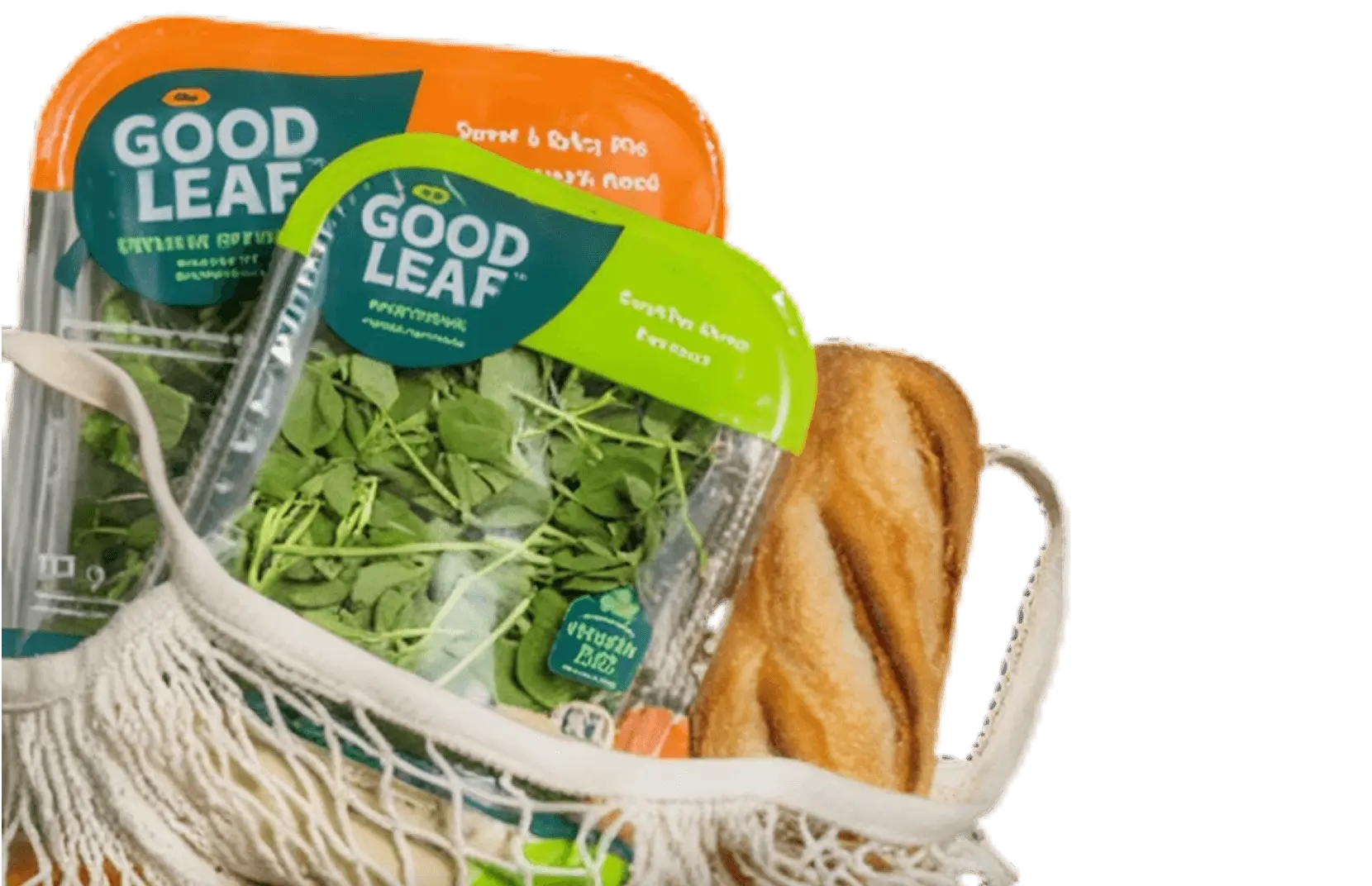 Packaged GoodLeaf greens and a loaf of bread in a string tote bag.